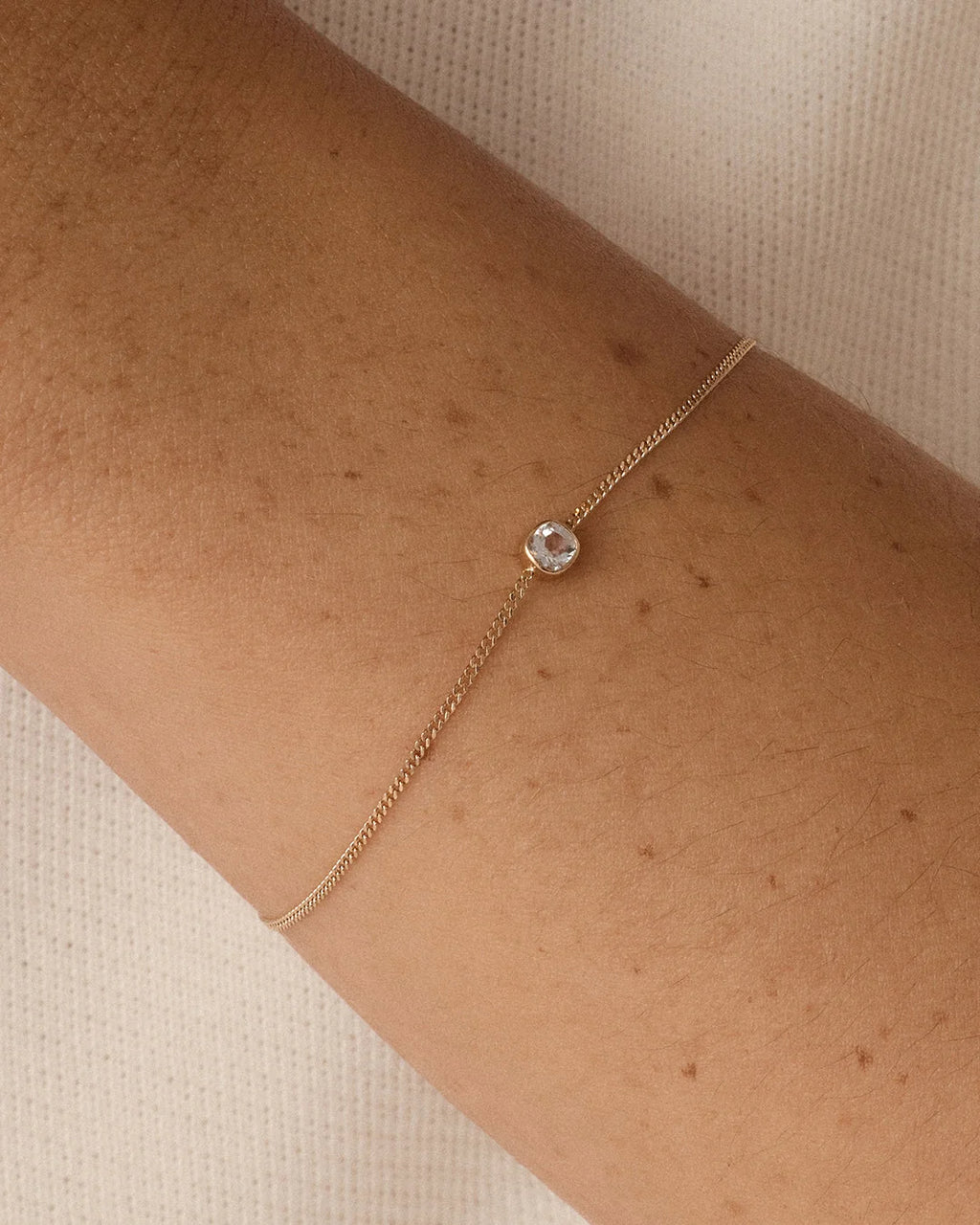 14K Gold Wilder Birthstone Bracelet - White Topaz - April worn on wrist