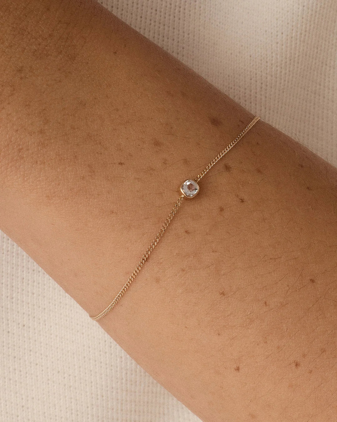 14K Gold Wilder Birthstone Bracelet - White Topaz - April worn on wrist