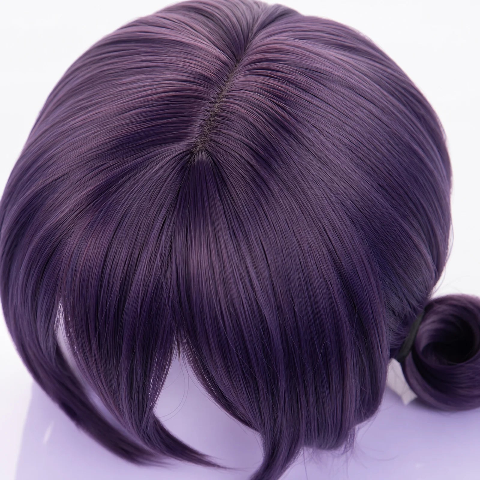Close-up of CosNova purple heat-resistant synthetic wig fiber and crown parting