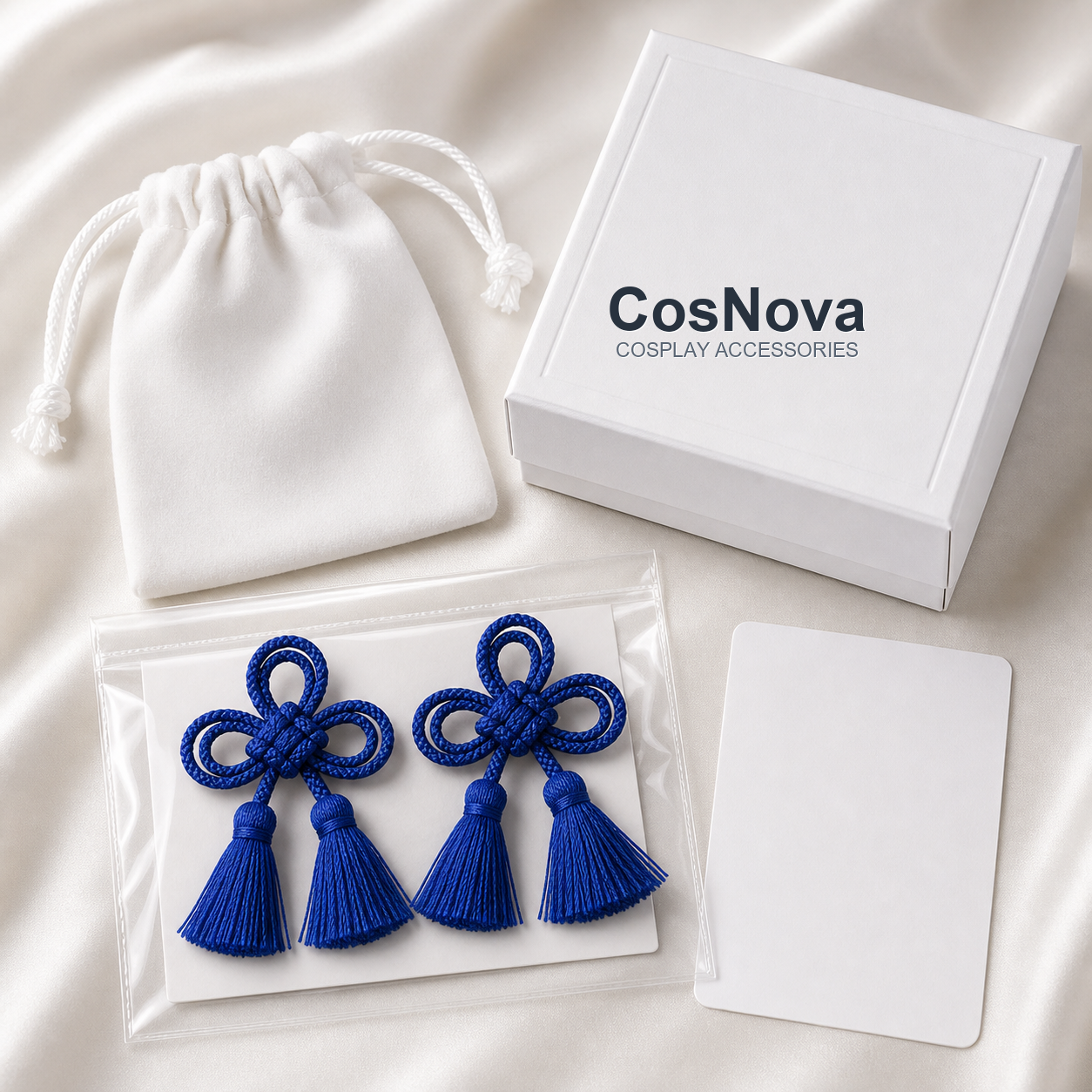 CosNova royal blue knotted tassel brooch pair with white pouch protective sleeve box and care card