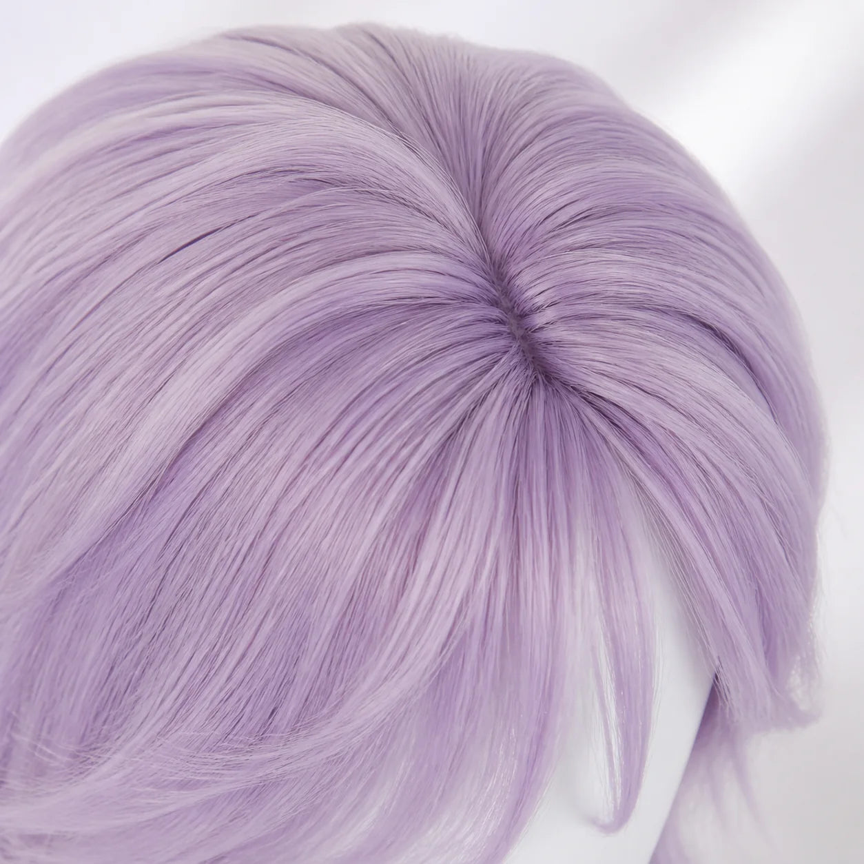 Close up of CosNova lavender purple wig fibers and natural crown parting