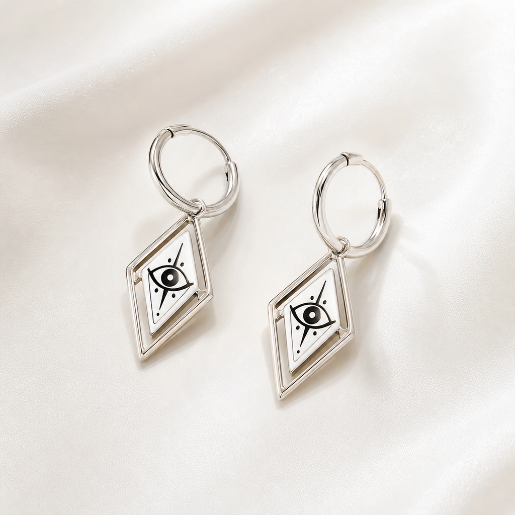 CosNova silver diamond eye hoop earrings pair with white printed diamond charms on satin background